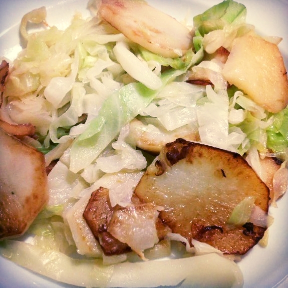 Sliced Potato and Cabbage Winter Salad - a hearty salad to keep you fueled and healthy as the weather changes. Made with extra virgin olive oil, green cabbage, leek, potatoes, red pepper, and sea salt.
